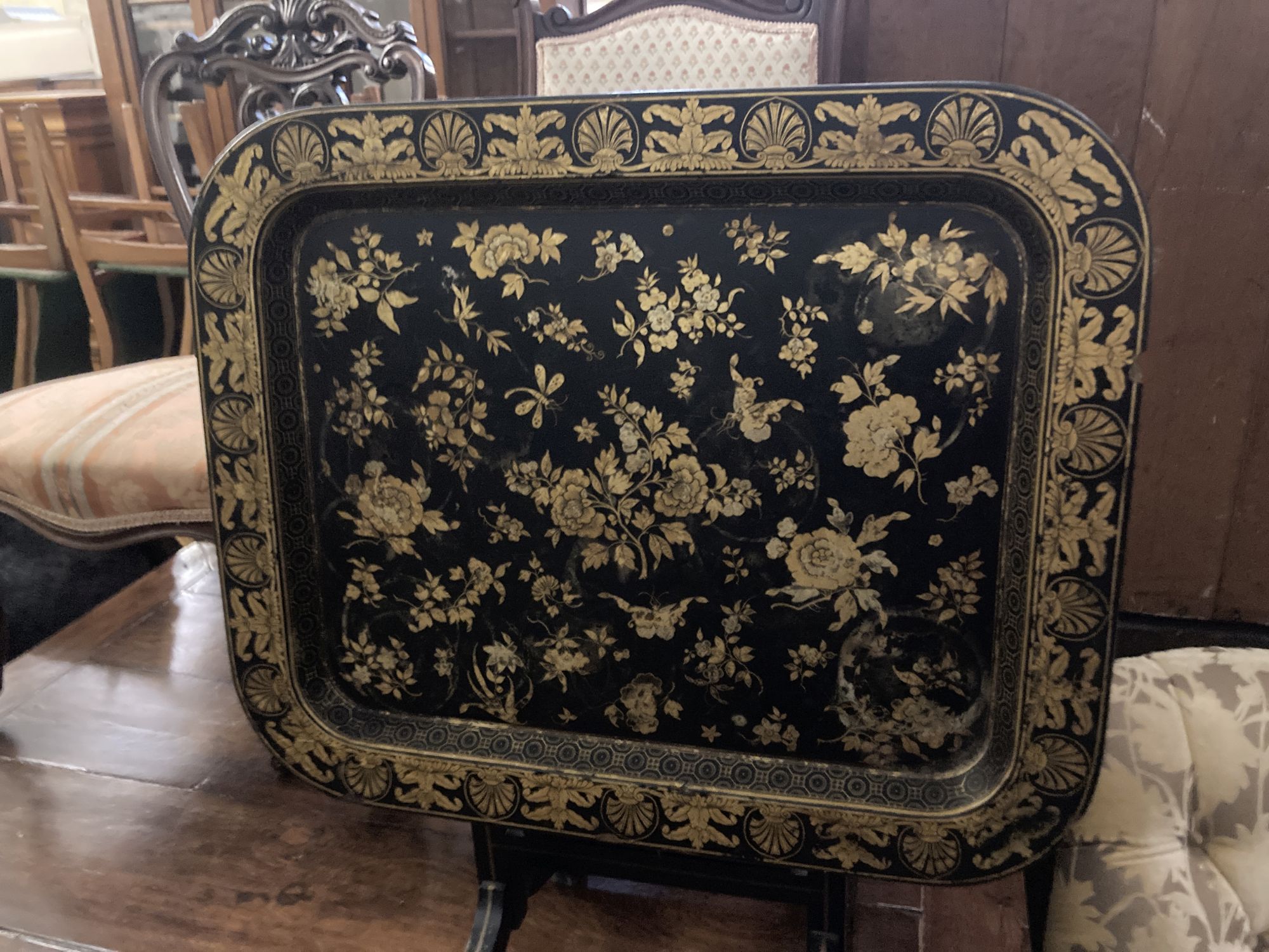 A Regency style rectangular chinoiserie gilt lacquered folding tray table, width 55cm, depth 46cm, height 50cm